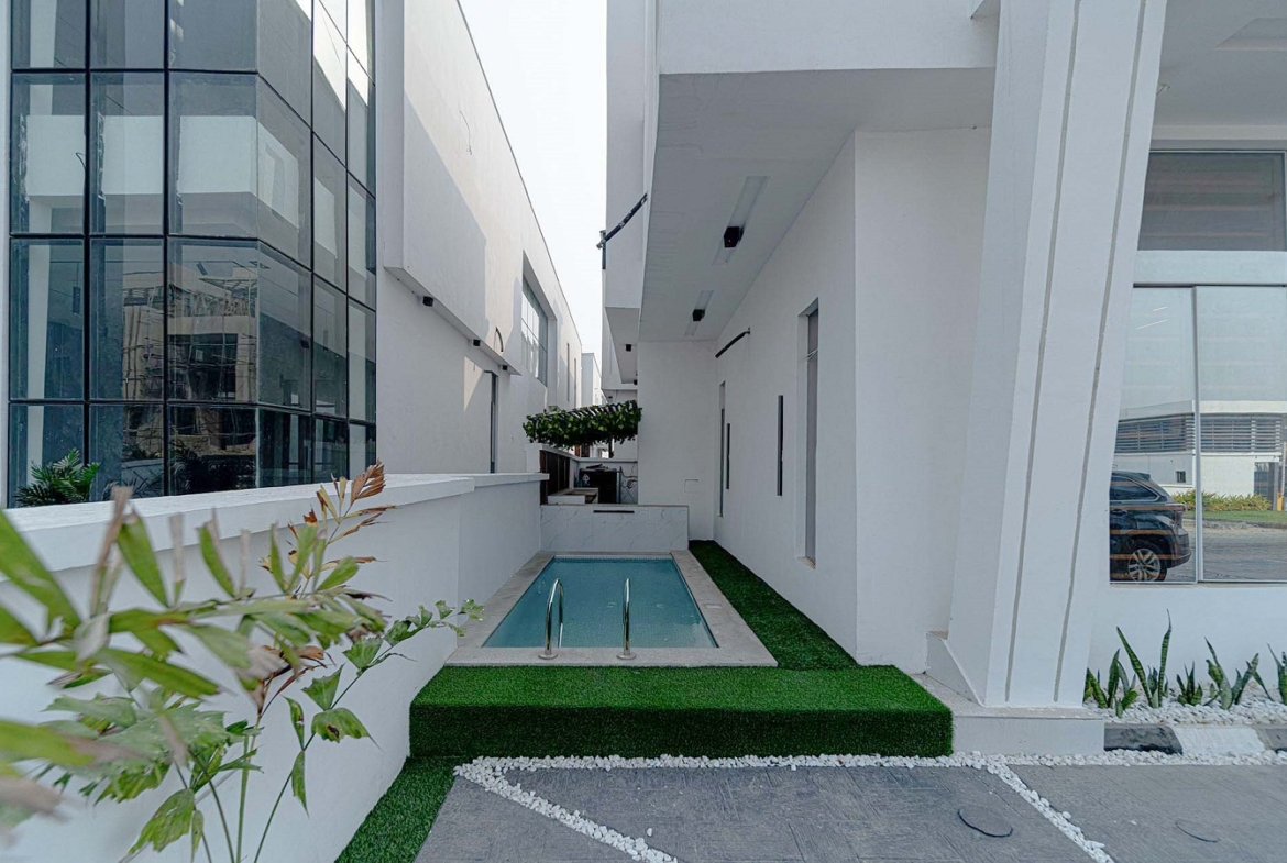 Description Step into a world of modern elegance with this newly built 2-bedroom, 2.5-bathroom apartment, located in the prestigious Ikate, Lekki neighborhood. Priced at ₦140 million, this property offers the perfect combination of sophistication and comfort for discerning homeowners or investors. Each bedroom in this stylish apartment is ensuite, providing privacy and convenience for all residents. The fitted bathrooms feature high-end finishes, complementing the sleek and functional design. The home is adorned with POP ceilings and recessed LED lights, creating a warm and contemporary atmosphere throughout. The fully fitted kitchen is a culinary delight, equipped with modern appliances to make meal preparation effortless. Chandeliers enhance the aesthetic appeal of the living and dining areas, adding a touch of class to the home. The balconies provide serene outdoor spaces to unwind and enjoy refreshing breezes or tranquil views. Built with practicality in mind, the property boasts a stamped concrete floor, easy access roads, and spacious closets for organized living. Situated in a secure gated estate, residents can enjoy peace of mind with consistent power supply and access to portable water. Living in Ikate, Lekki, means being at the heart of Lagos’ vibrant lifes